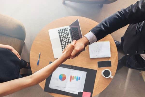 advisor shaking hands with client